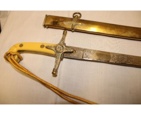 A copy General Officer's sword with decorated steel blade, brass hilt and composition grips in brass scabbard with sword knot
