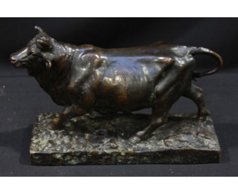 An antique bronze study of a prize bull, raised on a naturalistic base, 26 x 17cm.