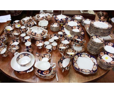 An extensive Edwardian Royal Albert Crown tea and dinner service, decorated in the "Imari" palette with cobalt blue, iron red