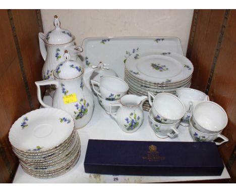 SECTION 26.  A Royal Tetton tea service of forty pieces decorated with forget-me-nots and a Royal Worcester cake slice.