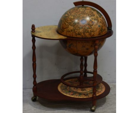 A reproduction Italian terrestrial globe bar, with composite wooden frame and decorated with faux antique maps, 63 x 64cm.