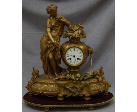 A 19th century gilded spelter French mantel clock, with eight-day movement striking a bell, white enamel dial with Roman nume