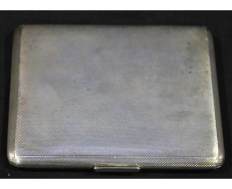 An engine turned silver cigarette case, London 1935, approximately 6.5oz gross.
