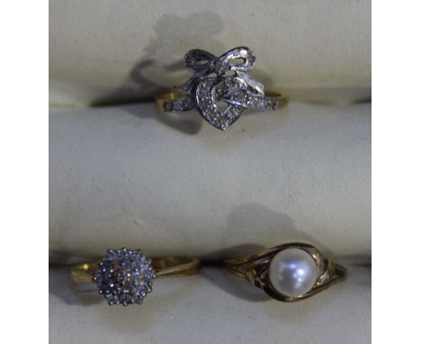 A 9ct gold solitaire pearl ring, 9ct gold three-tier diamond cluster ring and a 9ct gold diamond-set tied-bow love-heart ring