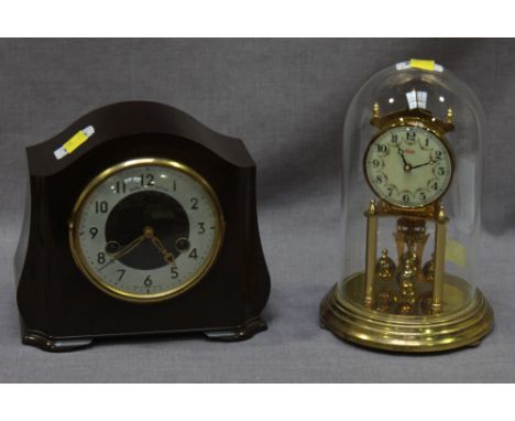 A Smiths mantel clock with striking movement in brown Bakelite case and an Anniversary clock under glass dome, (2).