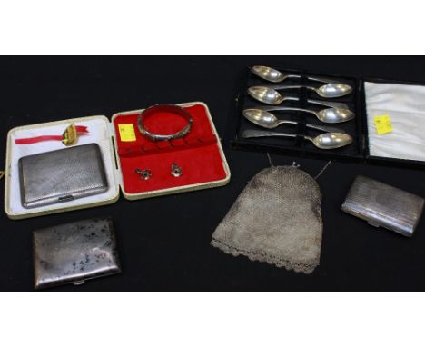Three various silver cigarette cases, white metal mesh purse, silver bangle, pair of silver earrings and cased set of six sil