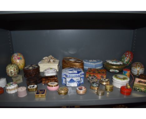 A mixed collection of vintage trinket boxes, pill boxes and tins. Various styles and shapes including Wedgewood and Shelley.
