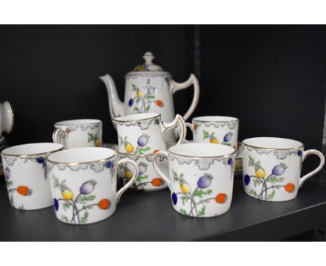 A vintage part coffee set having transfer pattern of poppy seed pods and delicate flowers, with hand coloured detailing and g