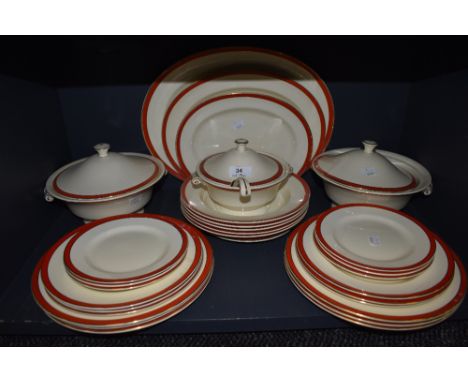 A vintage Mintons part dinner service, having red borders and gilt edging, included are tureens; one with serving ladle, vari