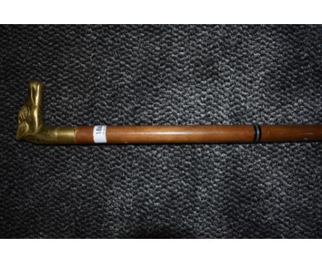 'A stick with an 'Orse's 'ead 'andle; the finest that Woolworths could sell'.... A three sectioned wooden walking cane with b