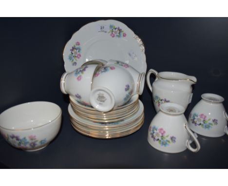 A Taylor and Kent bone china part tea set having pastel floral transfer pattern and gilt edging, included are sugar basin, pl