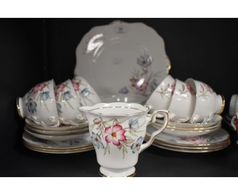 A vintage Royal Staffordshire part tea set having brown transfer pattern with hand coloured floral sprigs and gilt edging, in