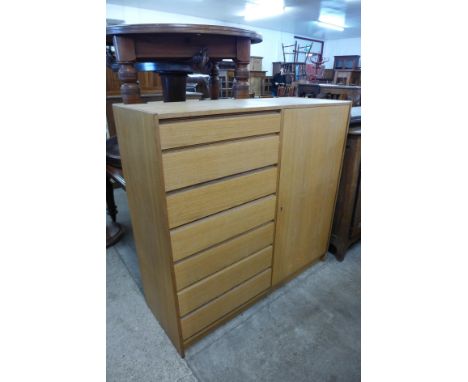 A light oak fitted tallboy 