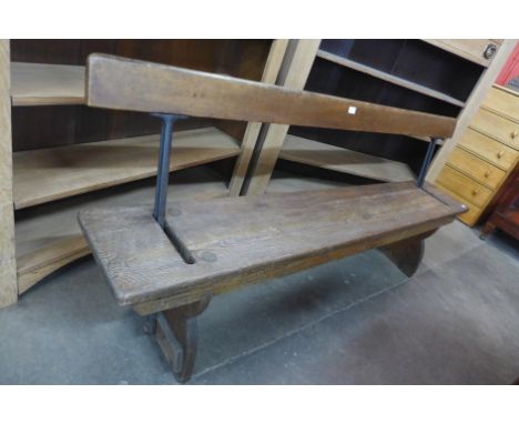 A cast iron and pine railway platform bench 