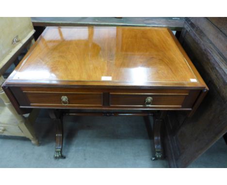 An Regency style inlaid mahogany sofa table 