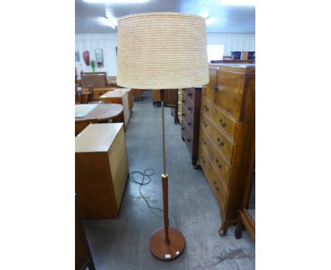 A teak standard lamp 