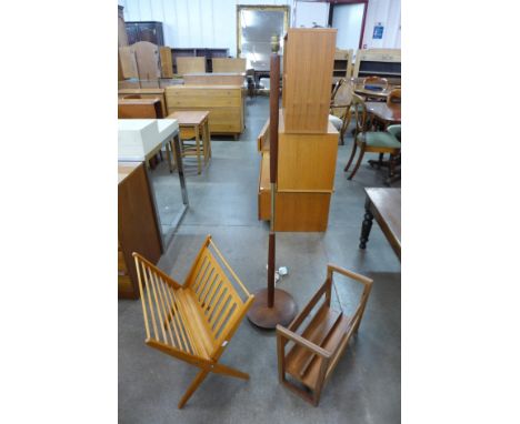Two teak magazine racks and a standard lamp 