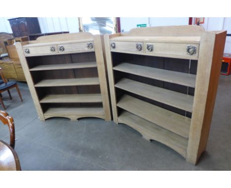 A pair of Arts and Crafts light oak open bookcases 