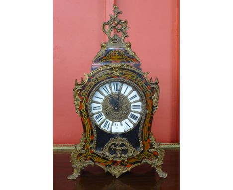 A Boulle style faux tortoiseshell and gilt metal bracket clock 