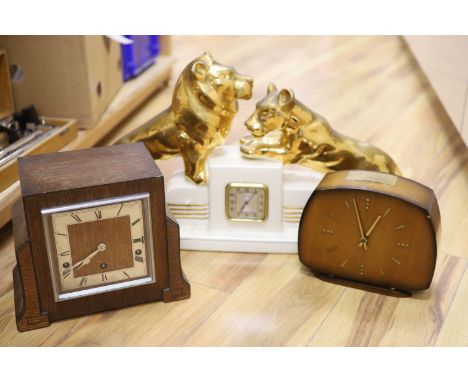 Two wooden Art Deco clocks and a ceramic clock modelled with lion cub