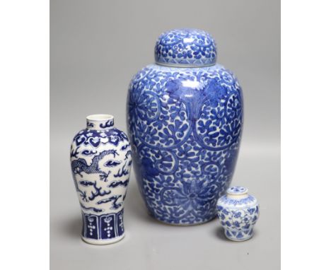 A Chinese blue and white 'lotus' jar and cover, early 20th century, a similar 'dragon' vase and a small Kangxi jarlet and cov