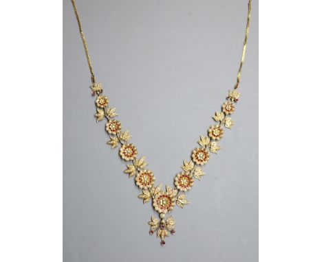 An early to mid 20th century Indian gilt metal, ruby and split pearl floral cluster drop necklace, approx. 50cm.