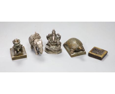 A group of Chinese bronze seals and a white metal elephant
