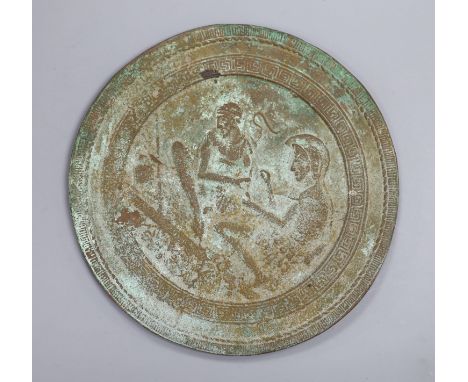A Greek or Egyptian cast bronze roundel, diameter 18cm