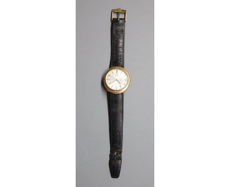 A gentleman's 9ct gold Omega manual wind dress wrist watch, on associated damaged leather strap, case diameter 33mm, gross 28