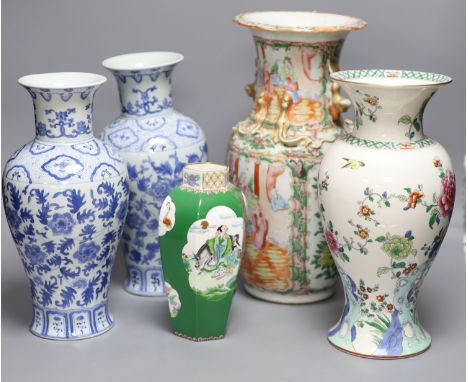 A Chinese famille rose Canton vase, a pair of blue and white vases and two others, tallest 35.5cm