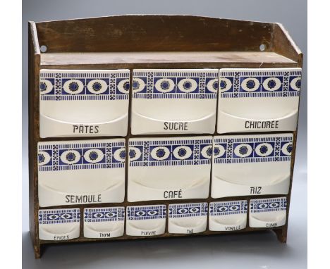 A French Spice cabinet with ceramic drawers, length 48cm