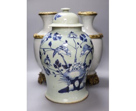A pair of Chinese crackleglaze vases and a blue and white vase and cover, height 43cm