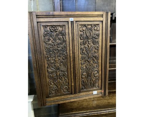 A late 19th century carved oak panel, width 72cm height 84cm