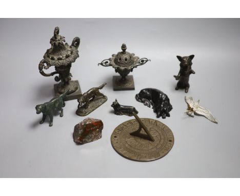 A collection of bronze and metal animals, sun dial and lidded urns etc