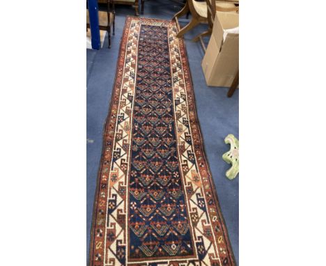 A Caucasian geometric pattern runner, 366 x 90cm
