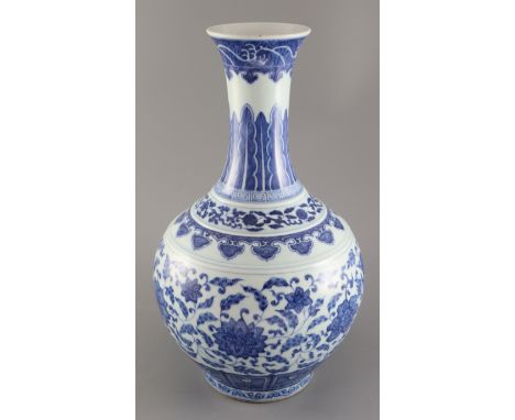 A Chinese blue and white Ming style bottle vase, Qianlong six character mark but later, painted with lotus flowers and scroll