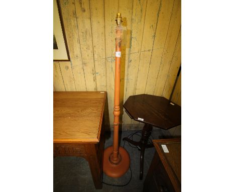 Orange painted standard lamp with map patterned shade