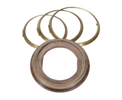Four cast brass dial clock bezels, anonymous, late 18th / early 19th century   Comprising of one with visible aperture of 10.