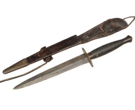 Commando Knife. A WWII Third Pattern Commando Knife, the 17cm double edge blade with brass crossguard and ribbed grip numbere