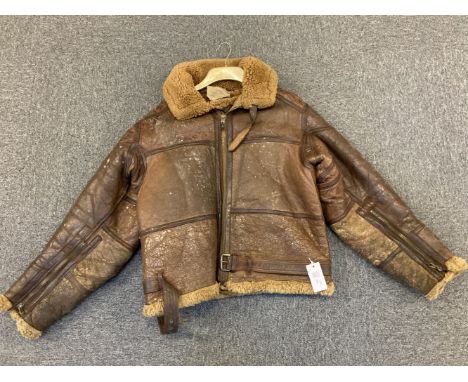 Flying Jacket. A WWII RAF Irvin brown leather flying jacket, sheepskin lined with war department tailors label stamped with s