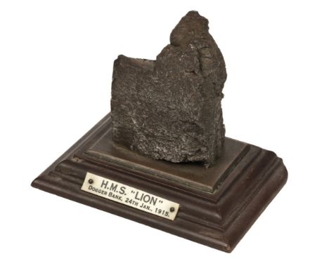 Battle of Dogger Bank. A piece of shrapnel, mounted on a brass and composite stepped base, the ivorine plaque stamped 'H.M.S.