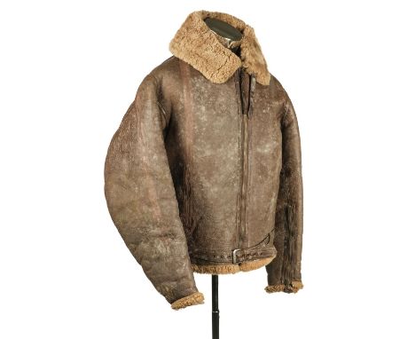 Flying Jacket. A WWII RAF Irvin brown leather flying jacket, sheepskin lined, two-panel back, dot zip to the front and cuffs,