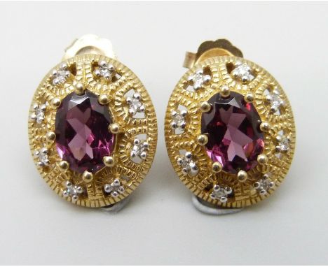A pair of 9ct gold earrings set with pink/purple stones and diamond borders, 2.8g, 1.2cm