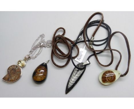 A collection of fossil jewellery set with ammonite, citrine, etc., one set in silver