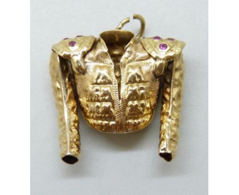A yellow metal charm in the form of a Matador jacket, set with pink stones, one missing, 2.8g