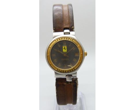 A Ferrari Formula 1 wristwatch made by Cartier, grey dial, quartz movement, on a brown leather strap, 31mm including crown, w