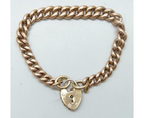 A 9ct gold curb chain charm bracelet with padlock fastener, 38g, 19.5cm