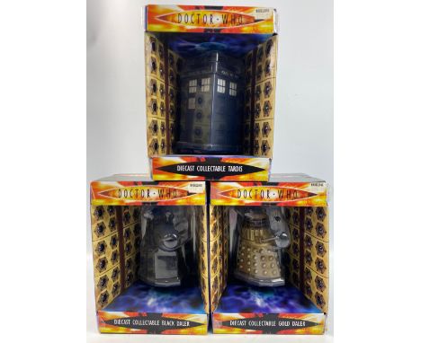 DOCTOR WHO die-cast collectible daleks in black and gold and a collectible TARDIS (some damage to corners of the boxes, conte
