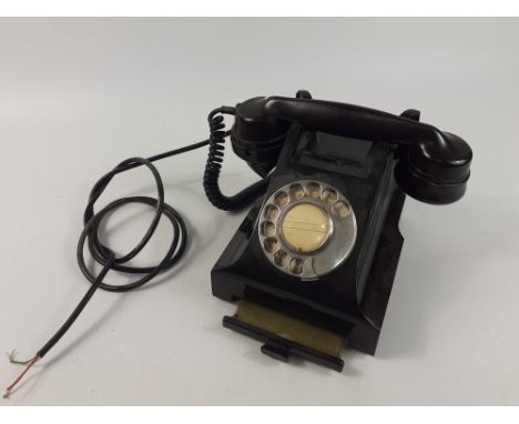 A vintage Bakelite telephone with a rotary dial and a drawer for storing phone numbers etc. Dimensions - 19cm long x 15cm wid