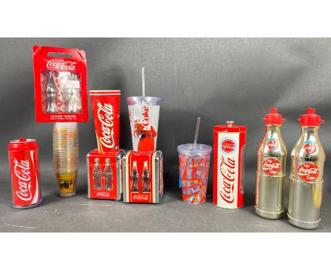 A large selection of COCA-COLA memorabilia to include 2 water bottles, a double-walled drinks can, a ceramic salt and pepper 